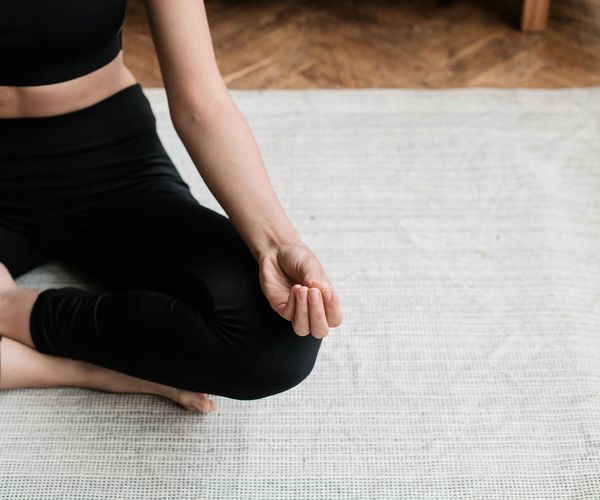 A person sitting in a calm meditation pose, symbolizing inner peace.
